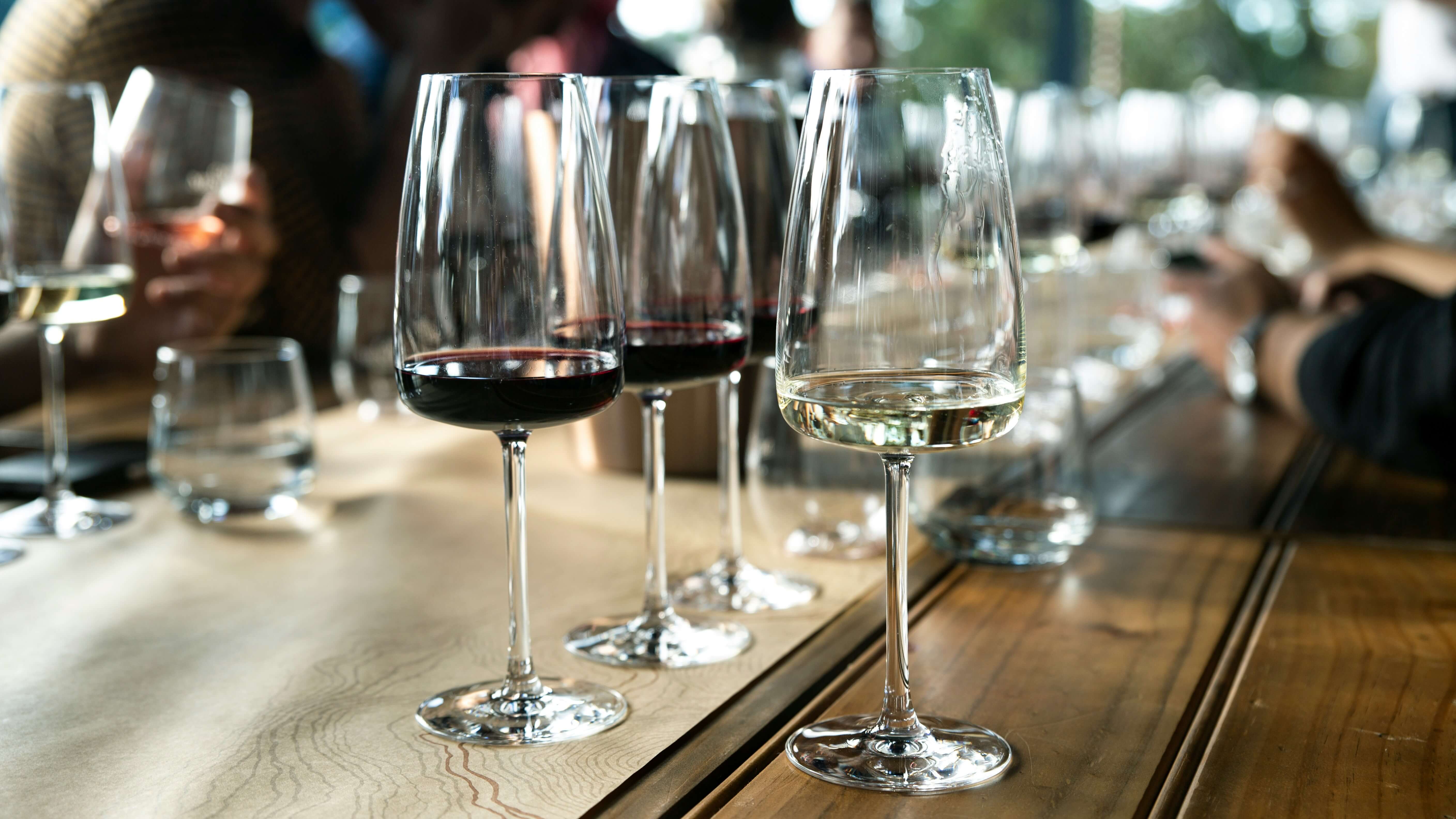 wine glasses on a long wooden table