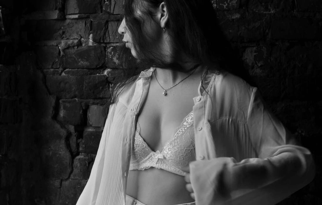 a woman standing in a bar looking away